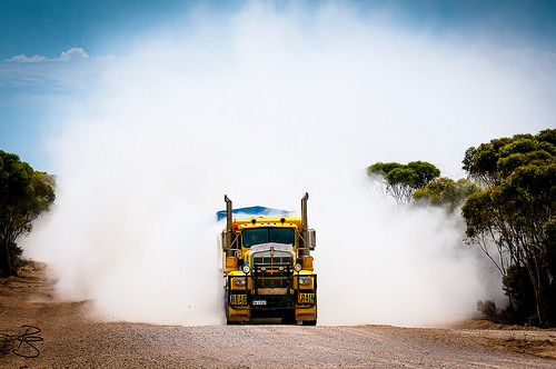 truck in dust cloud